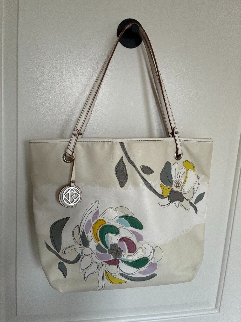 RELIC tote bag featuring a colorful floral appliqué design